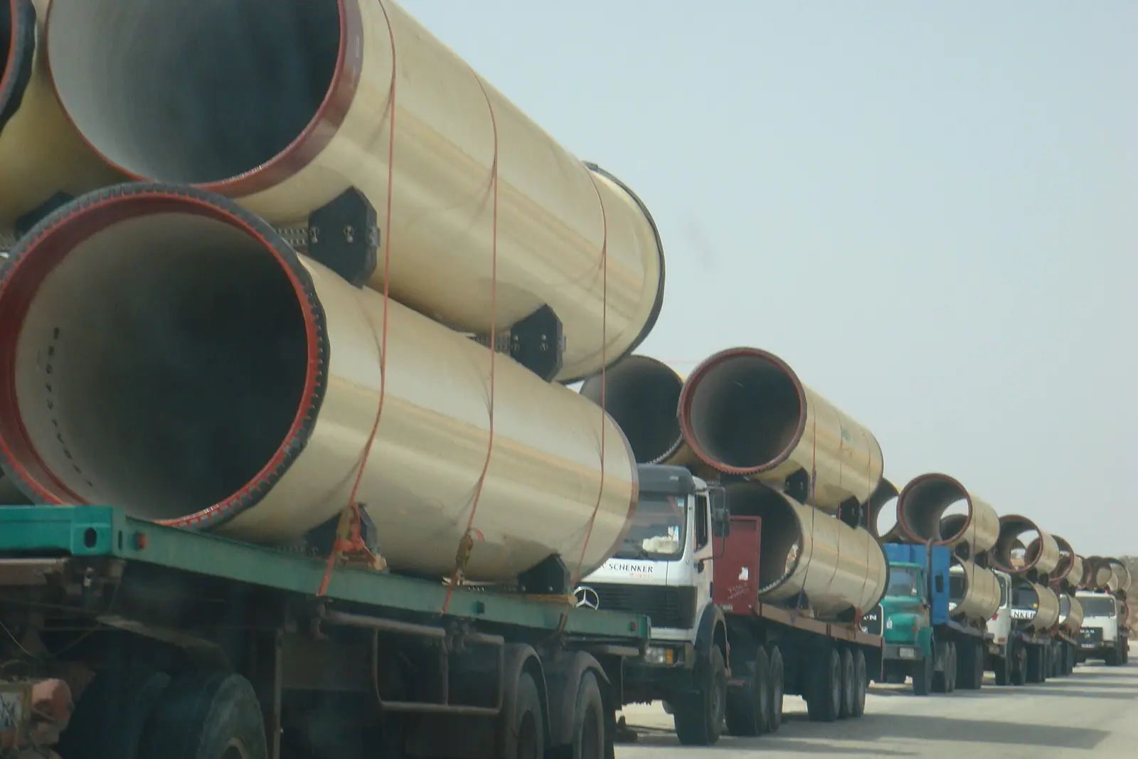 Large water pipes carried by truck